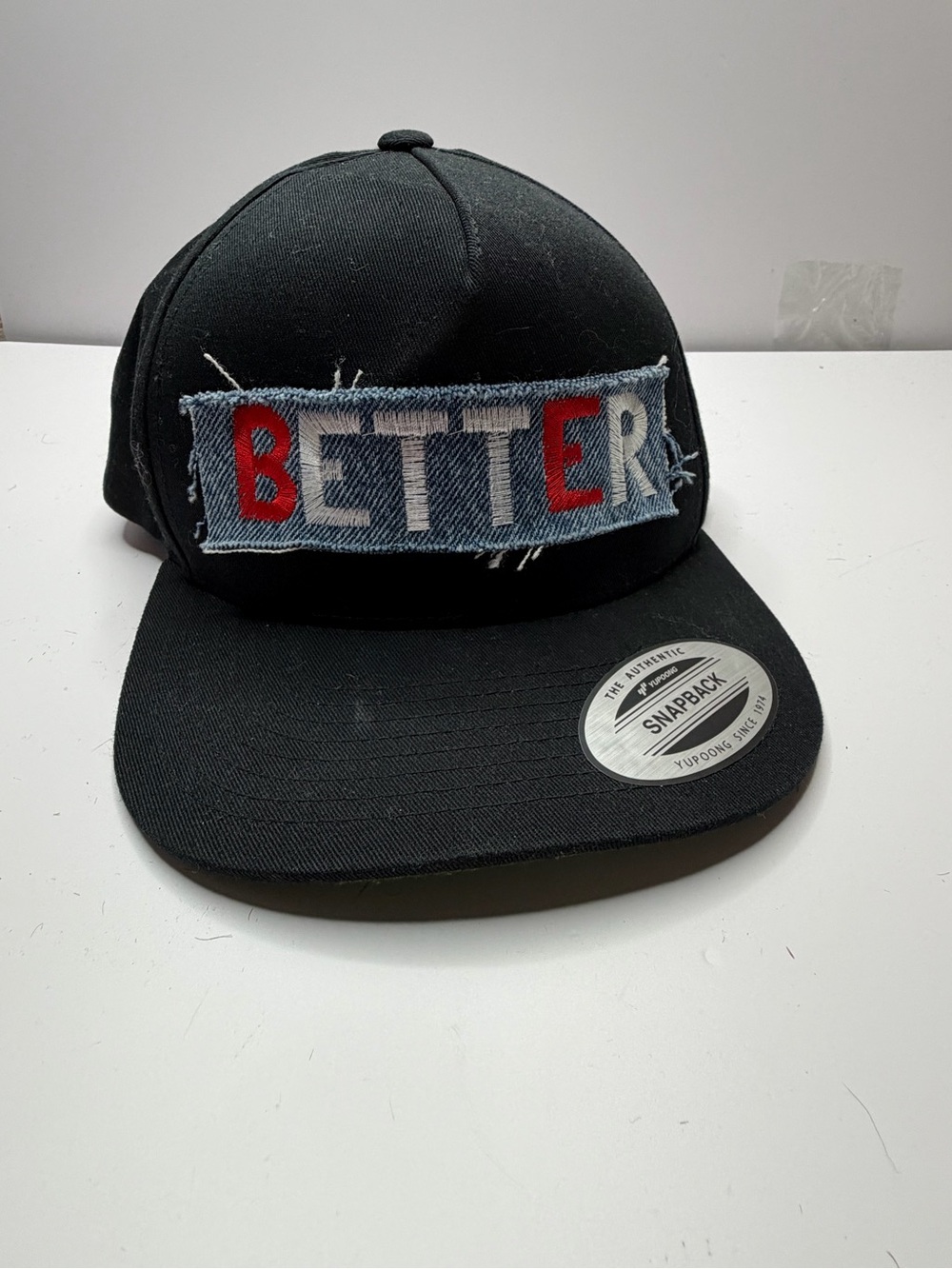 Black Snapback Hat with 'BETTER' Patch